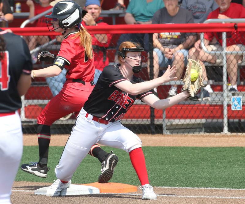 Benet Academy's Marikate Ritterbusch catches the ball at first base as Charleston's Avery Beals is safe during the Class 3A State third place game on Saturday, June 10, 2023 at the Louisville Slugger Sports Complex in Peoria.