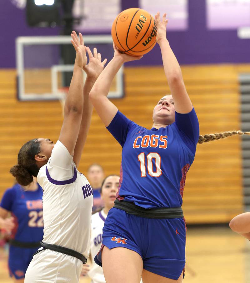 Genoa-Kingston's Arielle Rich shoots over Rochelle's Carmela Bright during their game Monday, Dec. 15, 2025, at Rochelle High School.