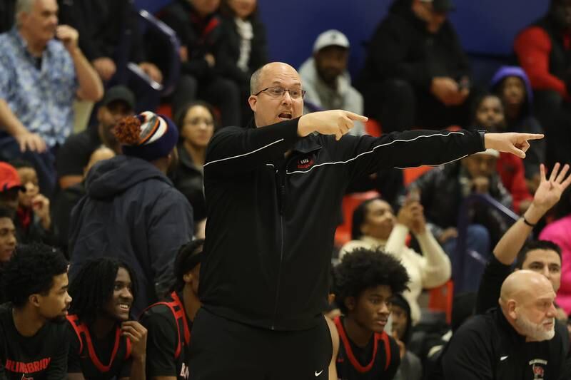 Bolingbrook head coach Rob Brost calls out to his players during the game against Romeoville on Tuesday, Dec. 2, 2025 in Romeoville.