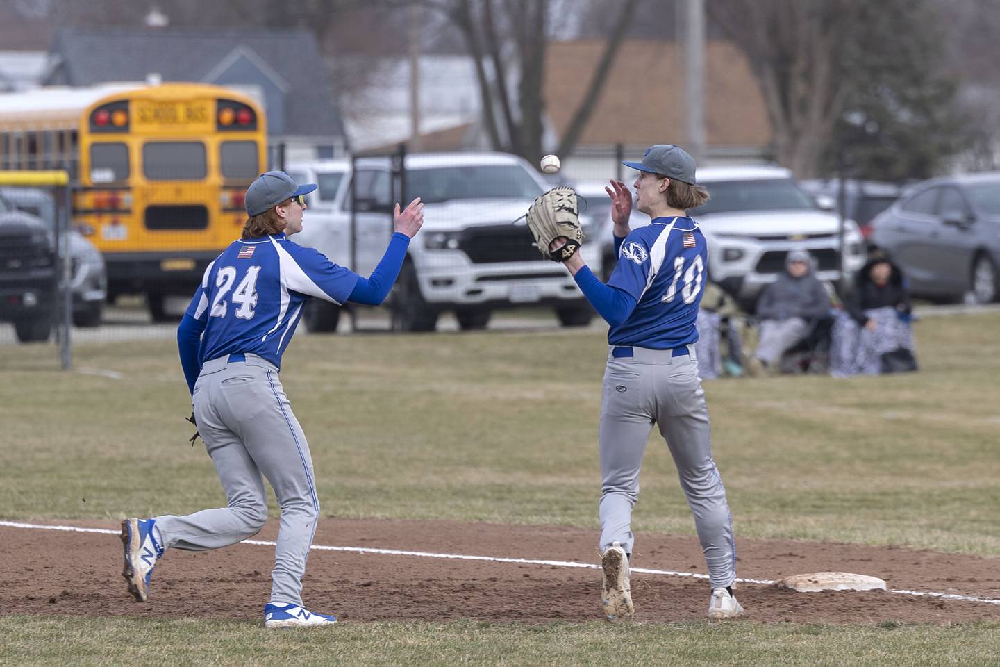 Princeton’s Jimmy Starkey flips the ball to pitcher Danny Cihocki covering first Thursday, March 23, 2023 against Rock Falls. Cihocki dropped the ball for an error.