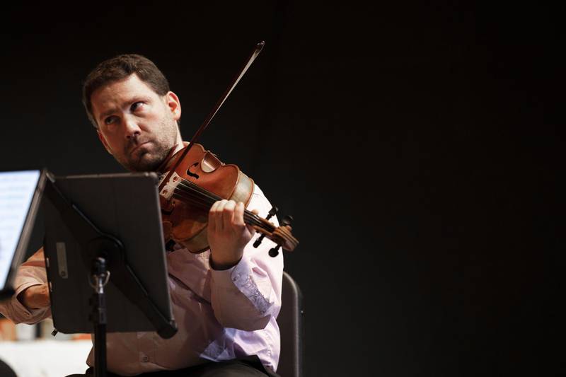 Kontras String Quartet viola player Ben Weber performs with his group Wednesday, Jan. 11, 2023 at Dixon Stage Left.