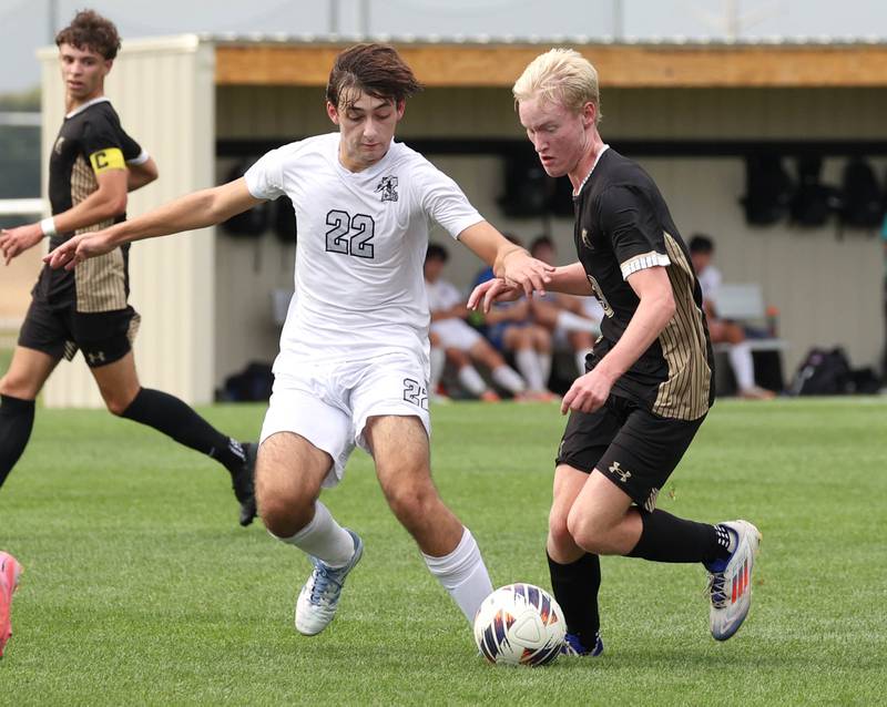 Kaneland's Carlos Landa (left) and Sycamore's Paxton Nicol fight for possession during their game Monday, Oct. 6, 2025, at Sycamore High School.