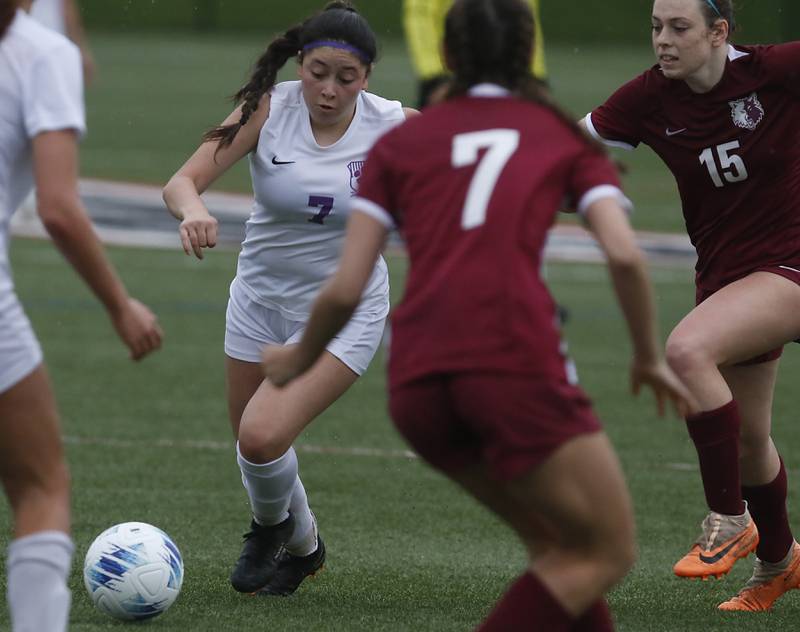 Hampshire's IIse Marquez controls the ball ass he id defended by Prairie Ridge's Grace Turman (center) and Olivia Mcpherson (right) during a Fox Valley Conference soccer game on Tuesday, April 16, 2024, at the MAC Athletic Complex in Crystal Lake.