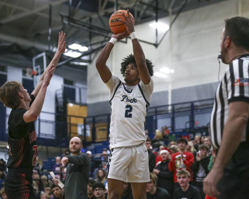 Oswego East's Jacsen Tucker (2) shoots a jump shot during their basketball game between Yorkville at Oswego East. Friday, Dec 19, 2025 in Oswego.