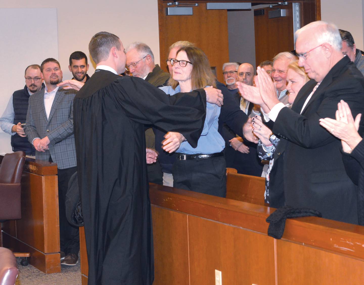 Russell Crull gives his mom a hug after being sworn in as the new associate judge for the 15th Judicial Circuit on Thursday, Nov. 21, 2024 at the Ogle County Judicial Center in Oregon.