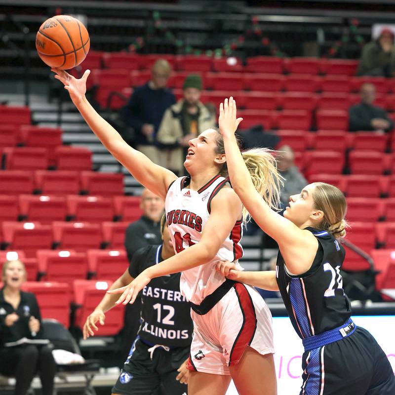 Northern Illinois' Brooke Blumenfeld gets to the basket ahead of Eastern Illinois' Ellie Buzzelle during their game Monday, Dec. 18, 2023, at the Convocation Center at NIU in DeKalb.
