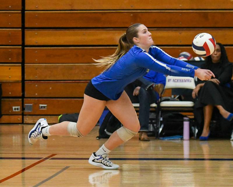 St. Charles North's Mia McCall (7) bumps the ball while taking on Benet Academy on Thursday Nov. 7, 2024, during the West Aurora 4A sectional championship match up.