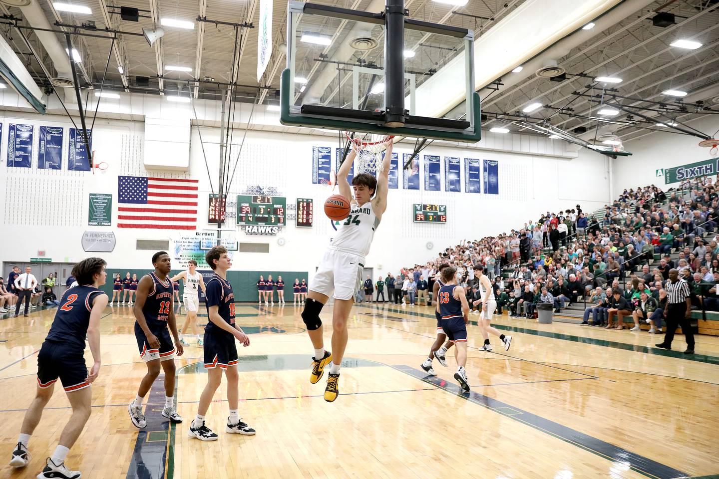 Glenbard West’s Braden Huff dunks the ball during a Class 4A Bartlett Sectional semifinal game against Naperville North on Tuesday, March 1, 2022.