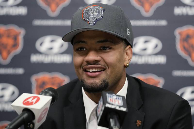 Wide receiver Rome Odunze, selected by the Chicago Bears on Thursday in the first round of the NFL football draft, smiles as he listens to reporters during a news conference in Lake Forest, Ill., Friday, April 26, 2024.