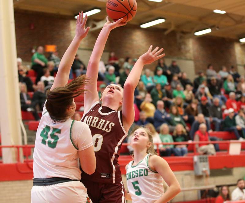 Morris's Landrie Callahan is met in the lane by Geneseo's Carolanne Greene during a drive to the hoop in the Class 3A Regional basketball game on Tuesday, Feb. 14, 2023 at Ottawa High School.