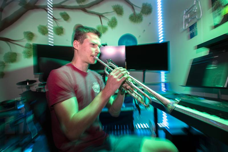 Newman High School student Maxwell DeForest plays a trumpet in the music room of his Dixon home Thursday, June 8, 2023. DeForest will be studying trumpet performance at the New England Conservatory in Boston this fall.