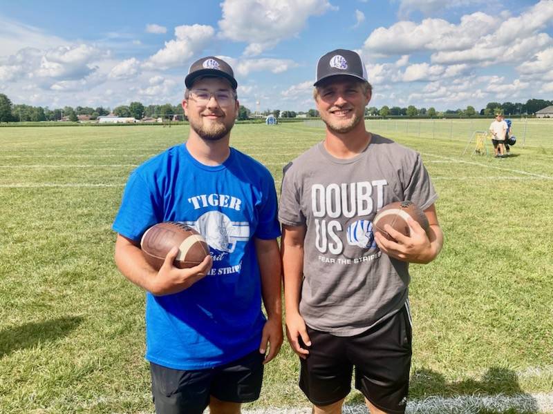 Max Taylor (left), a 2022 PHS alum, and Drake Davis, brother of three former Tigers have joined the Princeton Tiger staff this season.