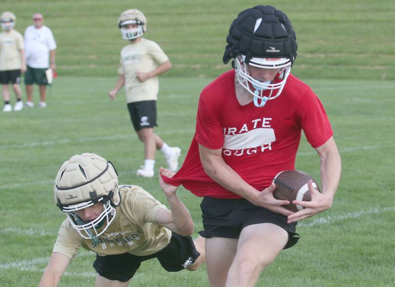 Ottawa's Owen Sanders makes a catch over St. Bede's Carson Riva during a 7-on-7 meet on Wednesday, July 24, 2024 at Ottwaa High School.