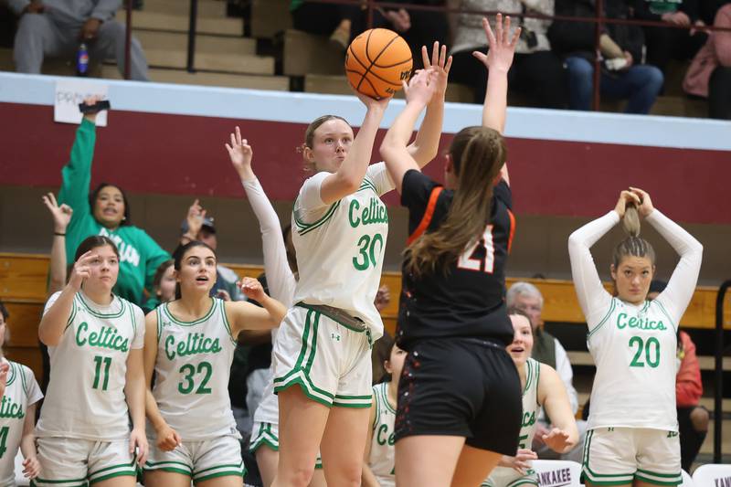 Providence’s Kennady Kotowski takes the outside shot against Washington in the Class 3A Kankakee Super-Sectional game on Monday, March 3, 2026 in Kankakee.