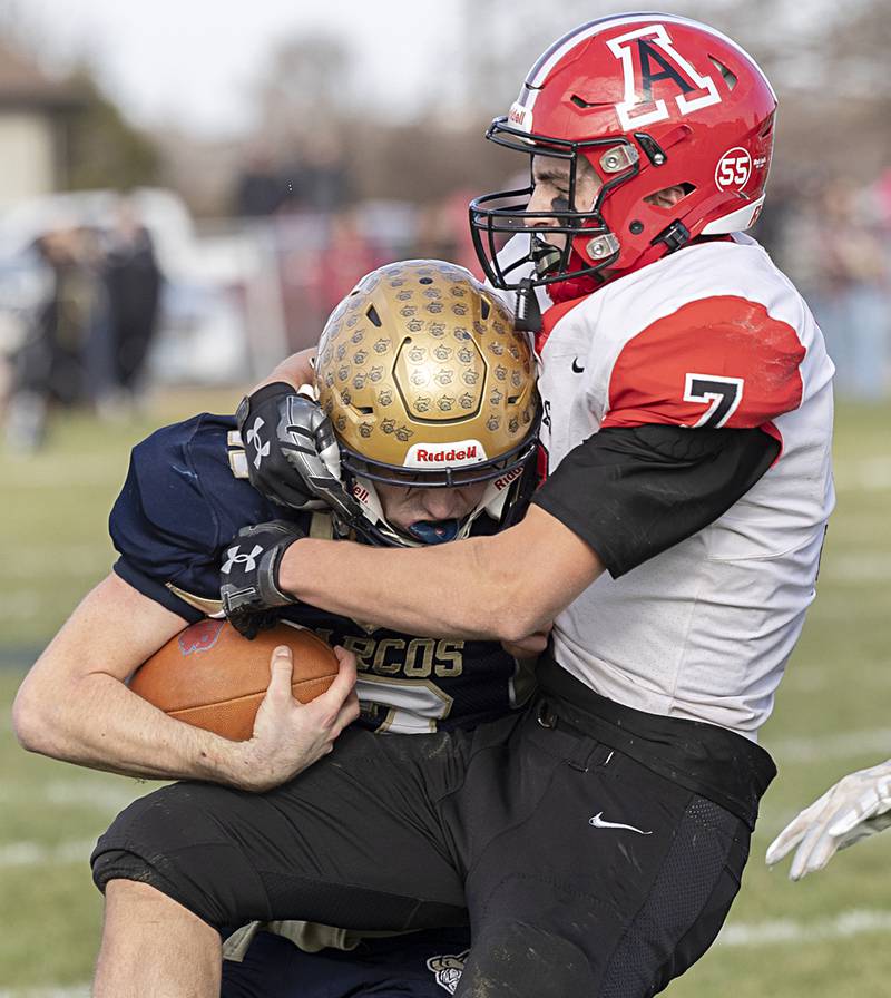 Polo’s Brock Soltow is hauled down by Amboy’s Troy Anderson Saturday, Nov. 11, 2023 during a semifinal 8-man football game in Polo.