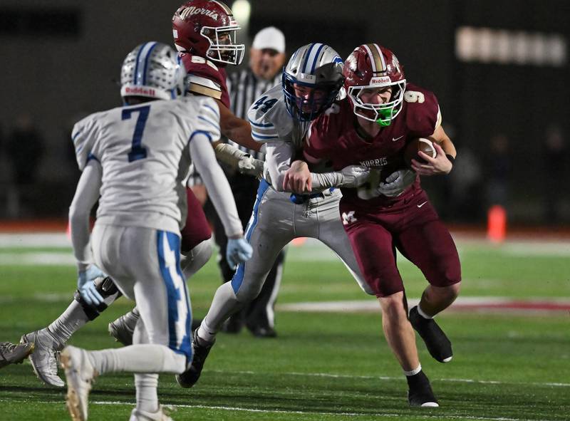 Morris' Caeden Curran (9) runs the ball during the class 4A first round playoff game against Woodstock on Friday, OCT. 31, 2025, at Morris.