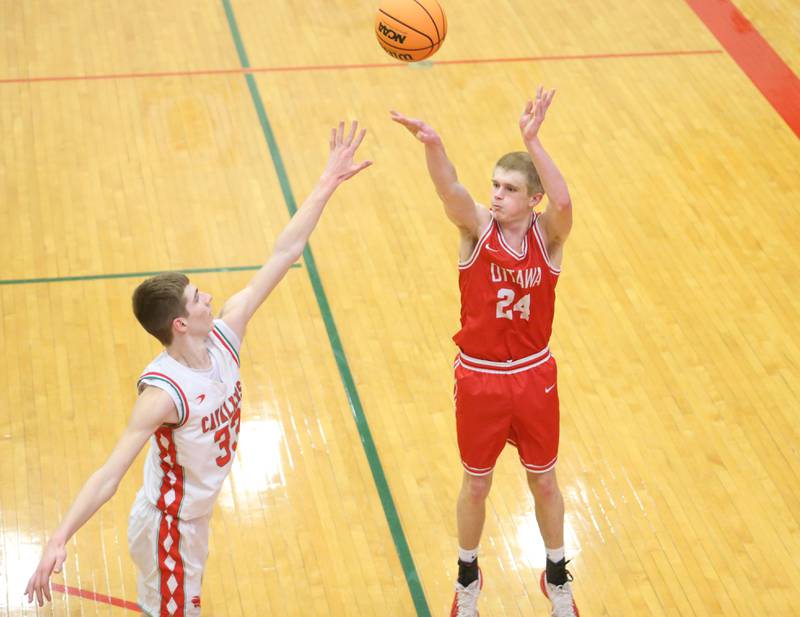 Ottawa's George Shumway lets go of a shot over L-P's Gavin Stokes during the Class 3A Regional title game on Wednesday, Feb. 25, 2026 in Sellett Gymnasium at L-P High School.
