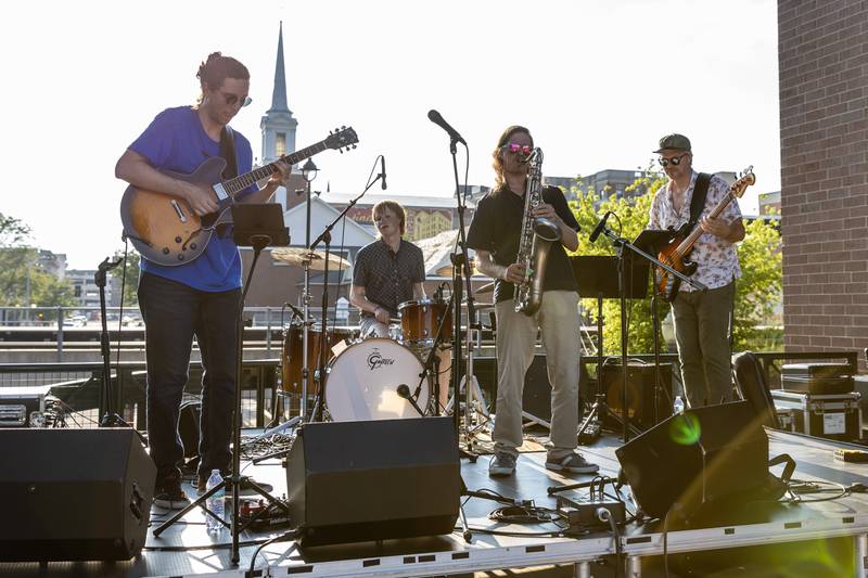 Sam Burns and Friends perform original songs like 'The Missing Piece' during New Orleans North Festival at Joliet Slammers Stadium on Aug. 15, 2025.