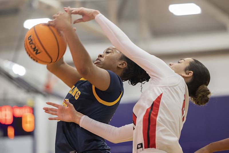 Sterling’s Joslyn Green works for a rebound against Stillman Valley’s Emma Withers Saturday, Dec. 27, at the Duchesses Basketball Christmas Classic.