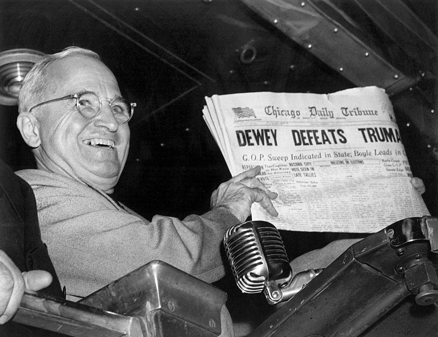 In this Nov. 4, 1948, file photo, President Harry S. Truman at St. Louis' Union Station holds up an election day edition of the Chicago Daily Tribune, which – based on early results – mistakenly announced "Dewey Defeats Truman."