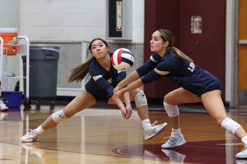 Lemont's Sam Arabe, left, and Bella Alagna both go for the volley during Lemont's loss two sets, 25-25, 25-18, to Providence in the IHSA Class 3A Kankakee Sectional championship on Thursday, Nov. 6, 2025.
