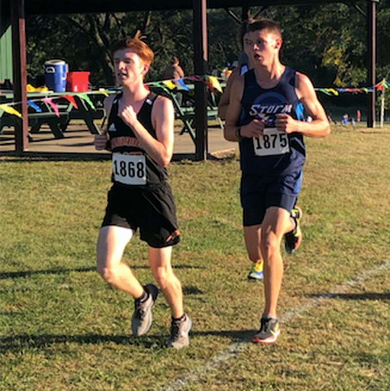 Bureau Valley's Elijah House (right) runs Tuesday at Walnut