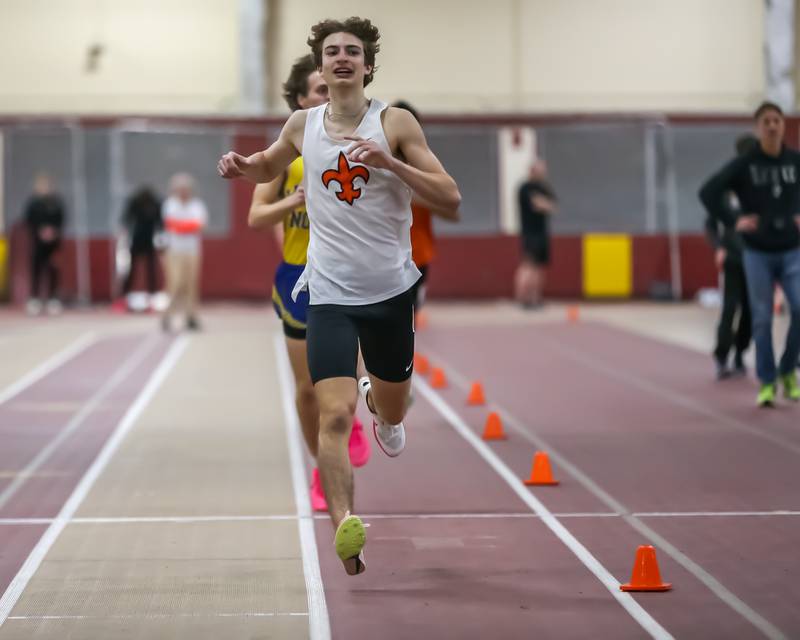 St Charles East's Greyson Ellensohn finishes first in the 1600 Meters during DuKane Boys Indoor Track and Field Conference Championships. Mar 16, 20