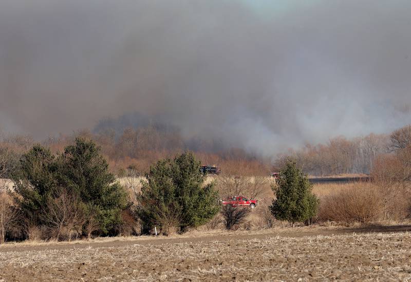 Ohio firefighters work a brush fire near the 24000 block of 2375th Road on Wednesday, Feb. 18, 2026 near Ohio. A Mutual Aid Box Alarm call was elevated to the second-alarm for the brush fire. Bureau County Fire departments from Princeton, Ohio, Malden and others assisted with the fire.