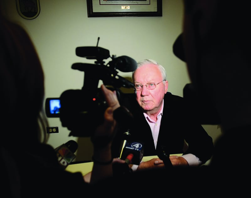 Dixon Mayor Jim Burke speaks with the media after a special City Council meeting called Monday morning to fire city Comptroller Rita Crundwell, accused of misappropriating $30 million of the city’s money since 2006.