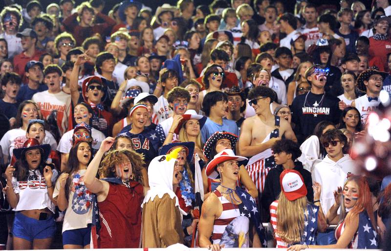 Yorkville student cheer at the second half kickoff during a varsity football game against New Trier at Yorkville High School on Friday, Sep. 1, 2023.