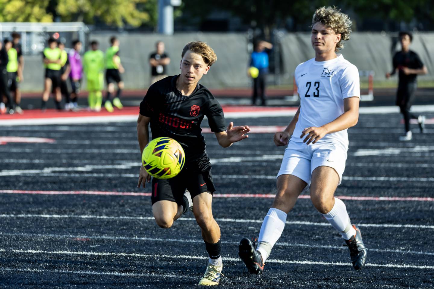 Bolingbrook's Jake Jablonski and Minooka's Landon Currie fight for control of the ball during a varsity soccer game in Bolingbrook on Sept. 16, 2025.