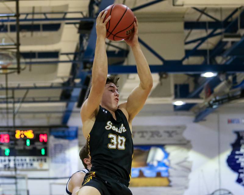 Hinsdale South's Brendan Savage (30) grabs a rebound during basketball game between Hinsdale South at Downers Grove South. Dec 1, 2023.