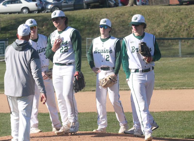 St. Bede head baseball coach Bill Booker talks to his players (from left) Carson Riva, Alan Spencer, Gus Burr and Luke Tunnell on Wednesday, March 20, 2024 at St. Bede Academy.