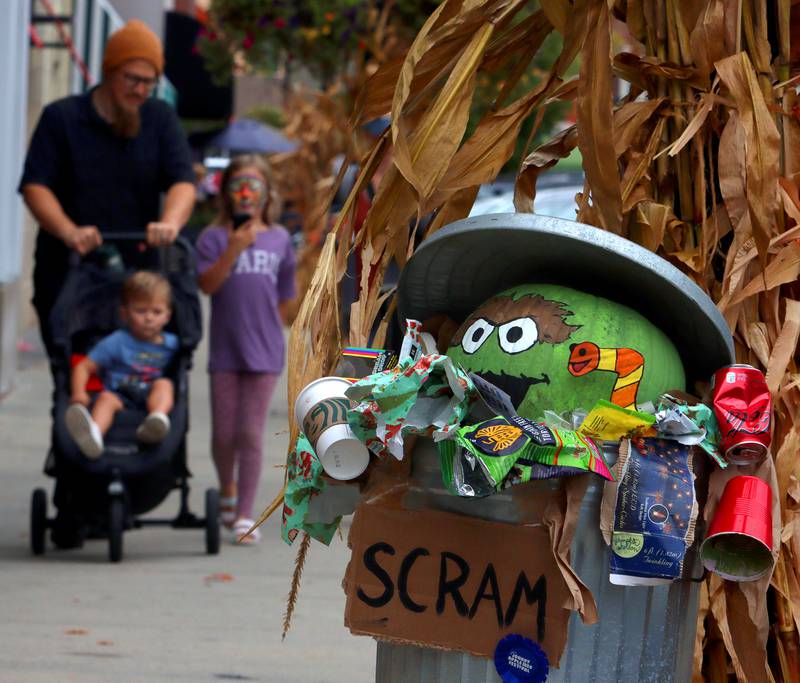 An Oscar-the-Grouch-themed display greets people during the Johnny Appleseed Festival in downtown Crystal Lake on Saturday Sept. 28, 2024, in Crystal Lake.