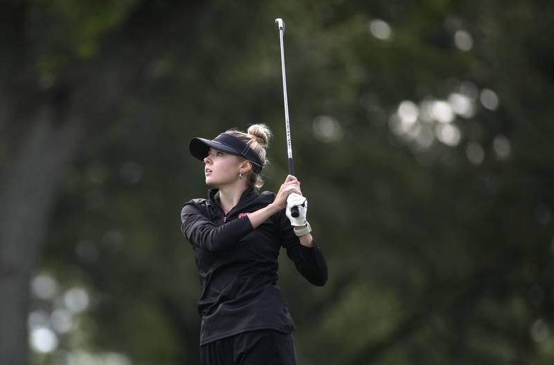 St. Charles East’s Charlotte Tassone tees off on the 10th hole during the Class 2A Glenbard North Regional girls golf meet at Bloomingdale Golf Club on Thursday, Sept. 28, 2023.