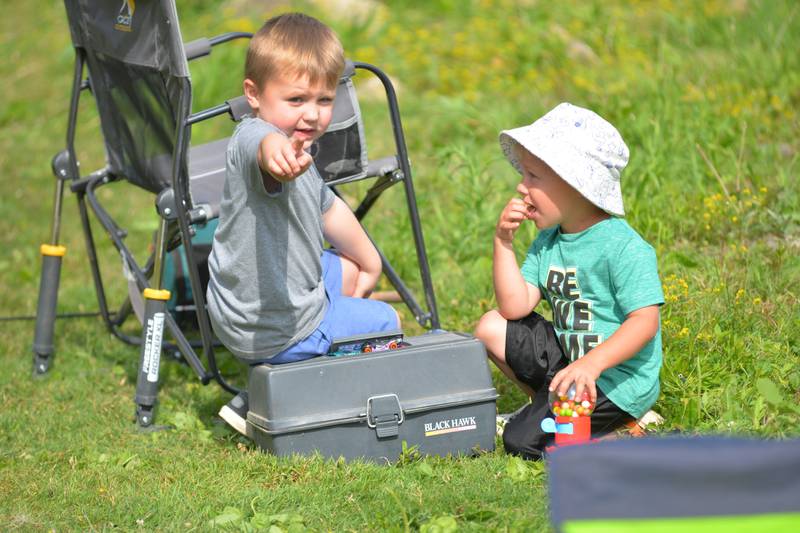 Huxley Imel, 3,  of Chadwick, and Bryce Larson, 4, of Dixon, talk fishing strategy at the 18th annual Dick Brown Fishing Derby at Prophetstown State Park on Saturday, June 15, 2024.