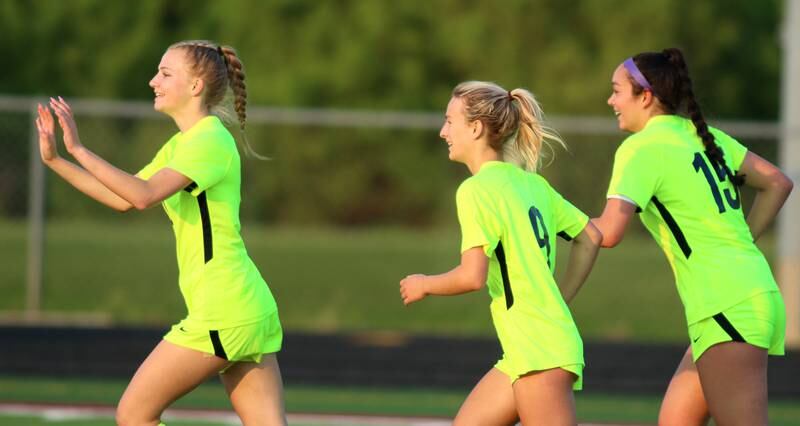 From left, Richmond-Burton’s Margaret Slove, Reese Frericks and Brianna Maldanado celebrate a Frericks goal against Willows in Class 1A Sectional title soccer action at Richmond Friday night.