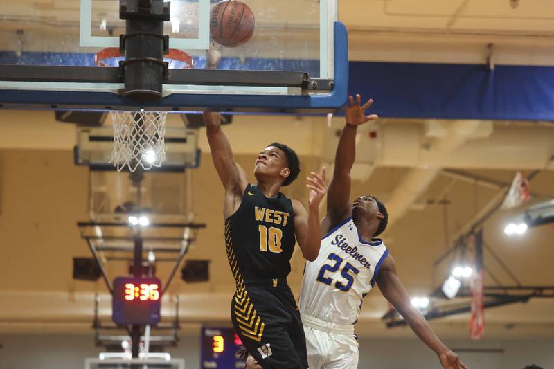 Joliet West’s Zion Gross lays in a shot against Joliet Central on Saturday, Jan. 27th, 2024 in Joliet.