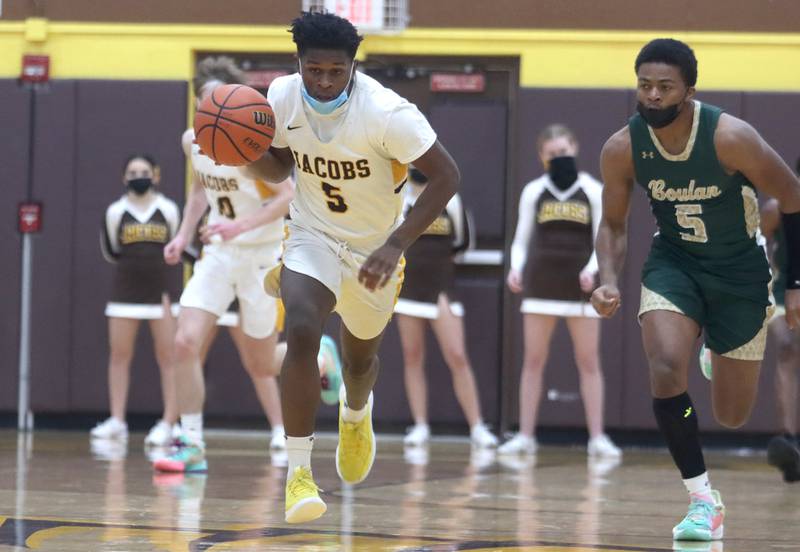 Jacobs’ Elijah Destin cruises with the ball during boys varsity basketball against Rockford Boylan at Algonquin Saturday afternoon.