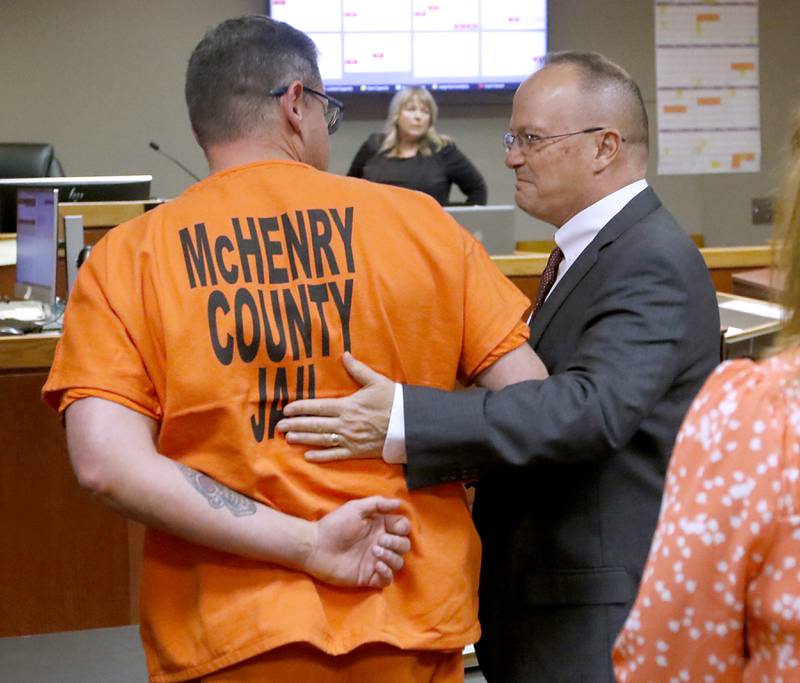 Charles Gozzola receives a pat on his back from his defense attorney Clay Mitchell after  McHenry County Judge Mark Gerhardt rendered a no-guilty verdict in Gozzola’s bench trial on Monday, May 6, 2024.