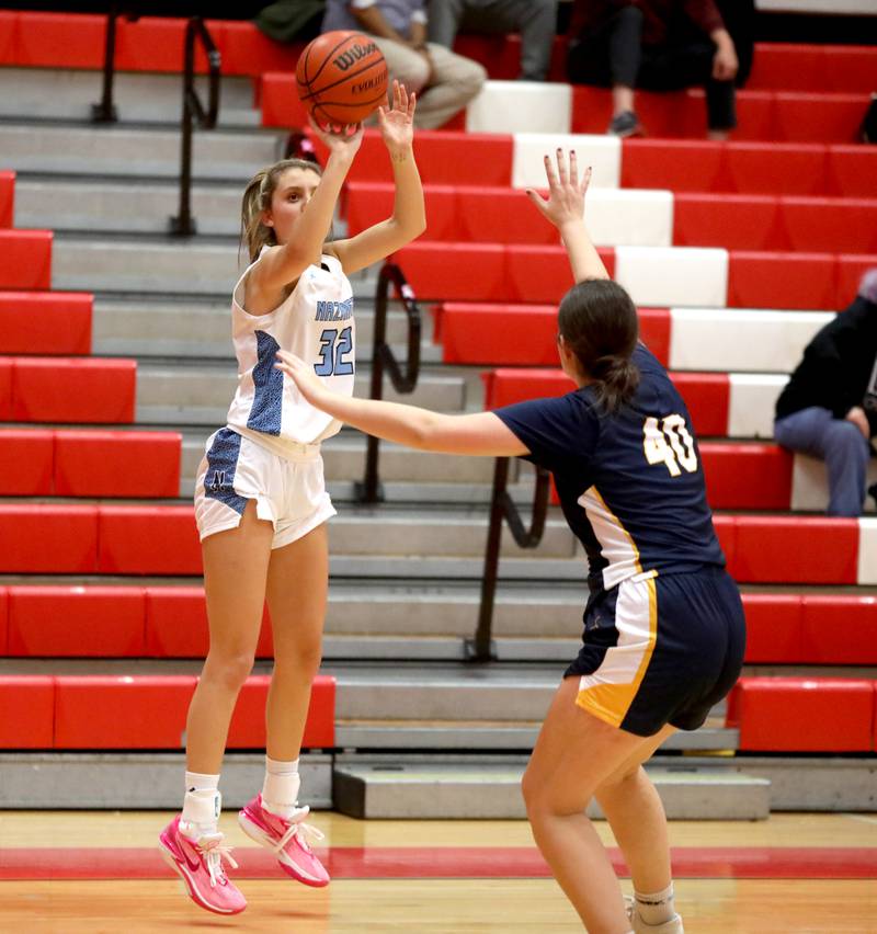 Nazareth’s Stella Sakalas shoots the ball during a game against Neuqua Valley at Hinsdale Central on Thursday, Nov. 16, 2023.