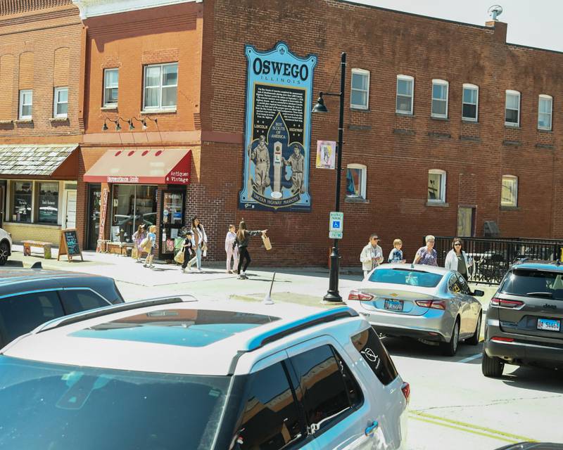 Community members check out all the shops that partook in the Bunny Hop event that handed out treats on Saturday April 12, 2025, held in downtown Oswego.