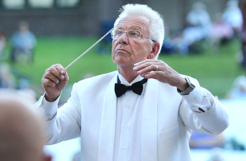 DeKalb Municipal Band conductor Kirk Lundbeck leads his group Tuesday, June 21, 2022, during the DeKalb Municipal Band concert at Hopkins Park in DeKalb. The band presents concerts at 7:30 p.m. during the summer every Tuesday through August 23, with the exception of July 5.