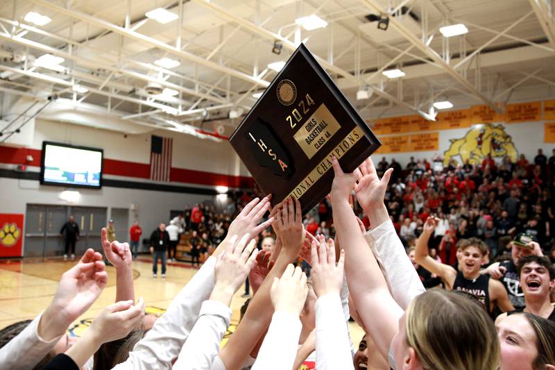 Batavia players celebrate their Class 4A Batavia Sectional final win over Geneva on Thursday, Feb. 22, 2024.