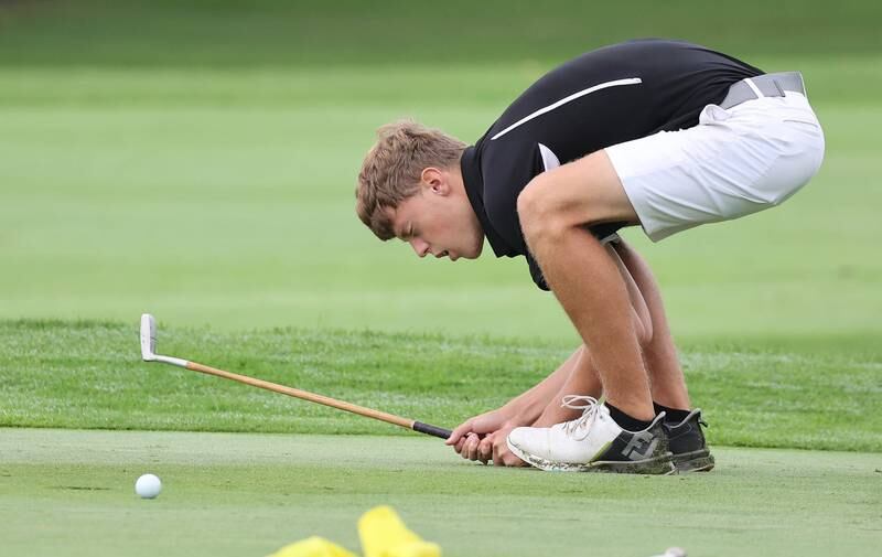 Kaneland’s Brian Davoust reacts to barely missing a birdie putt on the seventh green Wednesday, Sept. 27, 2023, during the Class 2A boys golf regional at Sycamore Golf Club.