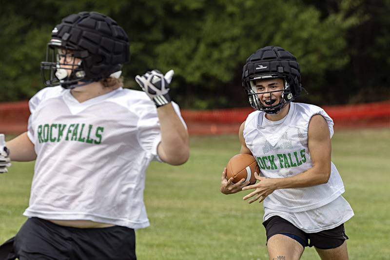 Rock Falls players run through drills Tuesday, August 8, 2023 during the first week of football practice.