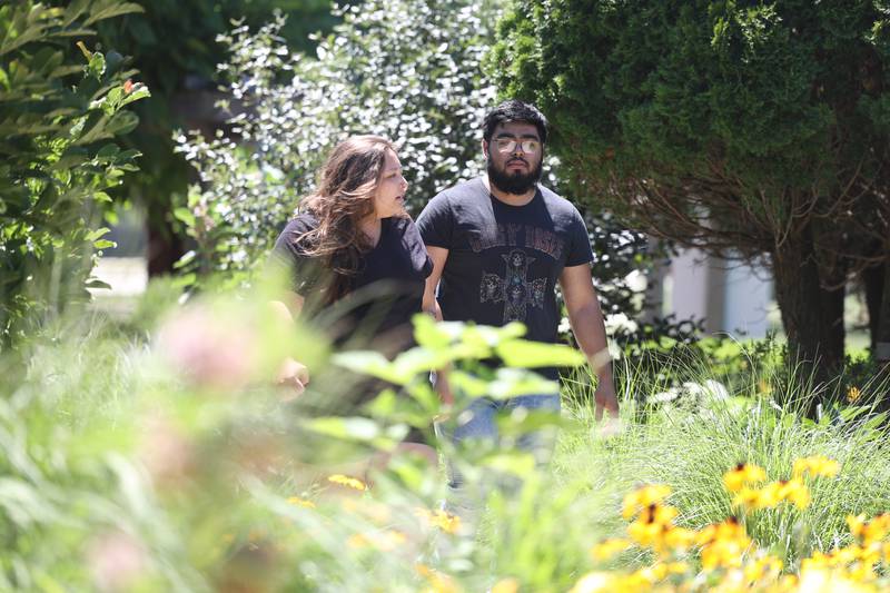 Jazmine Sanchez, of Joliet, brings her boyfriend Juan Preciado to the Children’s Garden in Elwood. Jazmine’s godmother would bring her and her sister to the garden when they were little girls. Saturday, July 9, 2022 in Elwood.