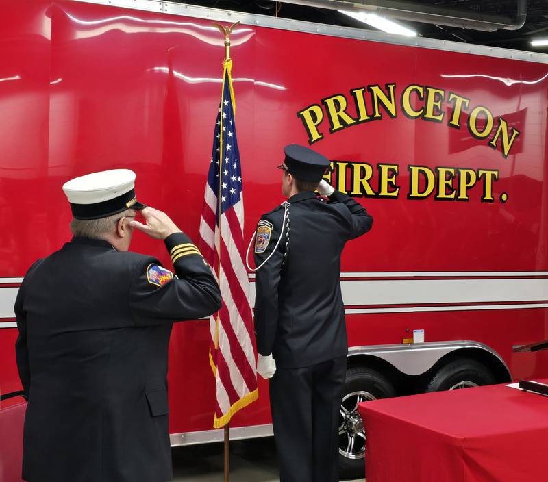 Princeton firefighters salute during the "Pledge of Allegiance" on Monday, March 3, 2025, as Nick Dykstra is promoted to lieutenant.