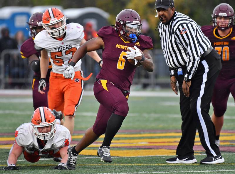 Montini's Jeremiah Peterson (6) sheds a Byron tackler on a big gain during a Class 3A second-round game on November 9, 2024 at Montini Catholic High School in Lombard.