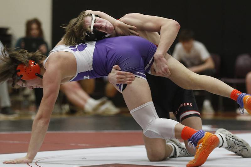 Huntley’s Shane McGuine controls Hampshire's Aric Abbott during the 150-pound match of a Fox Valley Conference wrestling match Wednesday, Jan. 24, 2024, at Huntley High School.